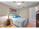 Bright bedroom with a comfortable bed and ceiling fan at 905 Linn Harbor Ct, Tarpon Springs, FL 34689