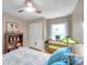 Well-lit bedroom with built-in shelving and closet at 905 Linn Harbor Ct, Tarpon Springs, FL 34689