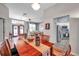 Spacious dining room with hardwood floors and kitchen view at 905 Linn Harbor Ct, Tarpon Springs, FL 34689