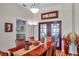 Bright dining room with hardwood floors and access to the pool at 905 Linn Harbor Ct, Tarpon Springs, FL 34689