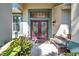 Welcoming front entrance with double doors and wooden bench at 905 Linn Harbor Ct, Tarpon Springs, FL 34689