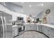 Modern kitchen with stainless steel appliances and white quartz countertops at 905 Linn Harbor Ct, Tarpon Springs, FL 34689