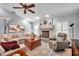 Relaxing living room with a fireplace and comfortable seating at 905 Linn Harbor Ct, Tarpon Springs, FL 34689