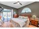 Large main bedroom with wood flooring and private access to the pool at 905 Linn Harbor Ct, Tarpon Springs, FL 34689