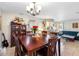 Classic dining room featuring a wooden table and chairs, with view to living room at 9445 Preston Rd, Brooksville, FL 34601