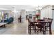 Open concept dining room flows into kitchen with tile flooring and a seamless transition to the living area at 9445 Preston Rd, Brooksville, FL 34601