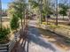 Long driveway leads to property offering privacy surrounded by mature landscaping and trees at 9445 Preston Rd, Brooksville, FL 34601