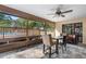 Enclosed patio featuring tiled floor, ceiling fan, and a view of the pool at 9445 Preston Rd, Brooksville, FL 34601