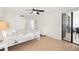 Bright bedroom with a queen-size bed and access to a balcony at 9495 Blind Pass Rd # 605, St Pete Beach, FL 33706