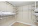 Large walk-in closet with wire shelving, providing ample storage space at 9495 Blind Pass Rd # 605, St Pete Beach, FL 33706