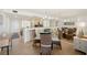 Dining area with a glass-top table and wicker chairs at 9495 Blind Pass Rd # 605, St Pete Beach, FL 33706