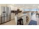 Modern kitchen with granite island and stainless steel appliances at 9495 Blind Pass Rd # 605, St Pete Beach, FL 33706