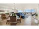 Living room with a sectional sofa and stunning water views at 9495 Blind Pass Rd # 605, St Pete Beach, FL 33706