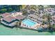 Resort-style pool and clubhouse by the water at 9495 Blind Pass Rd # 605, St Pete Beach, FL 33706