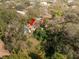 High-angle view showing property's setting amongst trees at 9810 Parsons St, Tampa, FL 33615