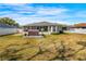 Beautiful backyard with lush grass, a privacy fence, and hot tub at 10340 Ventura Dr, Spring Hill, FL 34608