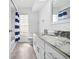 Bright bathroom features a shower, vanity and natural light at 10340 Ventura Dr, Spring Hill, FL 34608