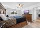Bright bedroom with view of the backyard, a flatscreen TV, and a comfortable king-sized bed at 10340 Ventura Dr, Spring Hill, FL 34608