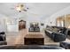 Expansive living room featuring hardwood floors, a TV, and adjacent dining area at 10340 Ventura Dr, Spring Hill, FL 34608