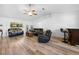 Bright living room features vaulted ceilings, hardwood floors, and comfortable seating at 10340 Ventura Dr, Spring Hill, FL 34608