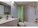 Clean bathroom with a shower/tub combo and a mirrored vanity at 10800 Us Highway 19 N # 108, Pinellas Park, FL 33782
