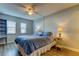 Comfortable bedroom with wood-look tile floors, ceiling fan and ample natural light at 10800 Us Highway 19 N # 108, Pinellas Park, FL 33782