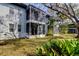 Building exterior featuring screened patios and lush landscaping at 10800 Us Highway 19 N # 108, Pinellas Park, FL 33782