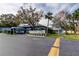 Charming condo complex featuring mature trees, lush landscaping and a convenient mail station at 10800 Us Highway 19 N # 108, Pinellas Park, FL 33782
