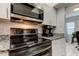 Modern kitchen features stainless steel appliances and granite countertops at 10800 Us Highway 19 N # 108, Pinellas Park, FL 33782