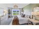 Bedroom with wallpaper accent wall, large window with natural light, and woven pendant lighting at 10869 Gentle Current Way, Parrish, FL 34219