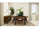 Dining room with dark wood table and chairs, sideboard, and art at 11559 E 71St Ter, Palmetto, FL 34221