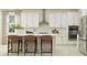 Modern kitchen featuring white cabinets and island at 11559 E 71St Ter, Palmetto, FL 34221
