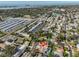 An aerial view displays a charming neighborhood, with lush greenery and hints of a home's private pool at 12341 79Th Pl, Seminole, FL 33772
