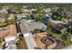 Aerial view of a single Gathering home showcasing a landscaped yard, pool, and community surroundings at 12341 79Th Pl, Seminole, FL 33772
