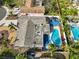 Aerial view of a residence showcasing the pool, outdoor cooking area, landscaped yard and nearby homes at 12341 79Th Pl, Seminole, FL 33772
