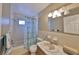 Bathroom with shower, sink, vanity, and medicine cabinet at 12341 79Th Pl, Seminole, FL 33772