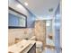 Updated bathroom featuring a vessel sink and a walk-in shower with decorative tile at 12341 79Th Pl, Seminole, FL 33772
