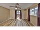 Spacious bedroom with wood-look vinyl flooring, ceiling fan, and natural light at 12341 79Th Pl, Seminole, FL 33772