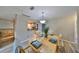 Inviting dining area with wood table, stylish decor, and easy access to the kitchen at 12341 79Th Pl, Seminole, FL 33772
