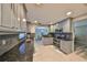 Updated kitchen features stainless appliances, mosaic tile backsplash, and granite countertops at 12341 79Th Pl, Seminole, FL 33772