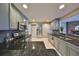 Modern kitchen with stainless steel appliances, granite countertops, and stylish cabinetry at 12341 79Th Pl, Seminole, FL 33772