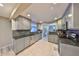 Updated kitchen with stainless appliances, granite countertops, and tile flooring at 12341 79Th Pl, Seminole, FL 33772