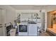 This functional laundry room boasts a washer, dryer, and utility sink for added convenience at 12341 79Th Pl, Seminole, FL 33772