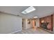 Open-concept living room with brick fireplace and view to kitchen and dining area at 12341 79Th Pl, Seminole, FL 33772