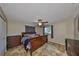 Main bedroom suite featuring ceiling fan and natural light at 12341 79Th Pl, Seminole, FL 33772