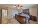 Main bedroom suite featuring ceiling fan and ensuite bathroom at 12341 79Th Pl, Seminole, FL 33772