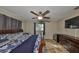Main bedroom suite featuring ceiling fan and natural light at 12341 79Th Pl, Seminole, FL 33772