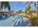 This beautiful pool is surrounded by palm trees, offering a refreshing oasis for relaxation and recreation at 12341 79Th Pl, Seminole, FL 33772