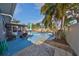 This beautiful pool is surrounded by palm trees, offering a refreshing oasis for relaxation and recreation at 12341 79Th Pl, Seminole, FL 33772