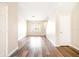 Well-lit living room with hardwood flooring, lots of natural light, and neutral paint at 12704 Country Brook Ln, Tampa, FL 33625